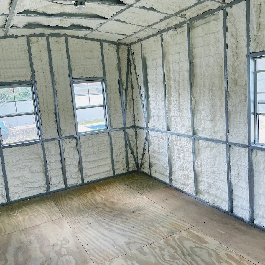 Closed-cell spray foam insulation applied to wall cavities in a residential project in Sterling